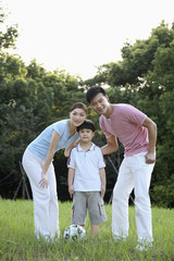 Woman, man and boy in the park