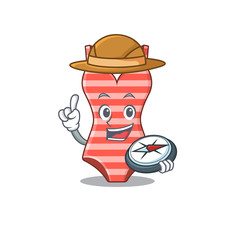 mascot design concept of swimsuit explorer using a compass in the forest