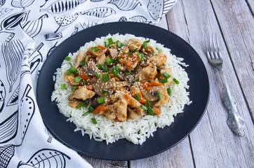 Stewed chicken with mushrooms, vegetables with herbs and rice