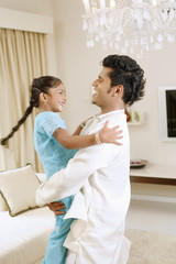 Man carrying his daughter