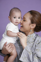 Woman playing with baby