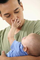 Man carrying baby