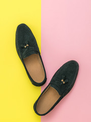 Original men's loafers on a yellow and red background.
