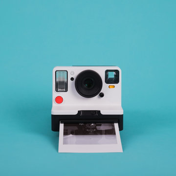 Close-up Of Instant Camera Against Blue Background
