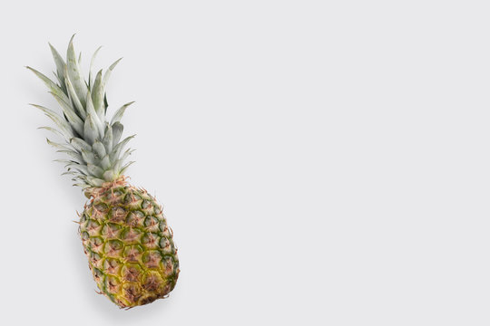 fresh pineapple close-up on a white background