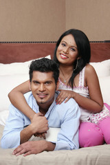 Obraz premium Man and woman posing in bed