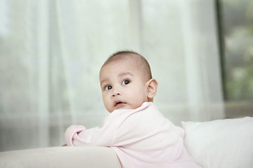 Baby standing on the couch