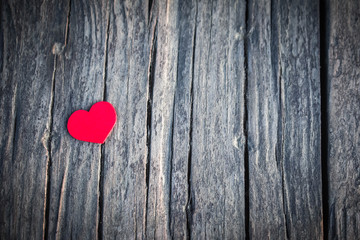 red heart on wooden background