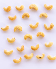 Roasted Cashew nuts and fly on it  isolated on white background with clipping path and full depth of field. Set or collection.