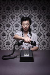 Woman holding vintage telephone receiver