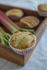 home made almond rhubarb muffins on a table