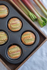 home made almond rhubarb muffins on a table
