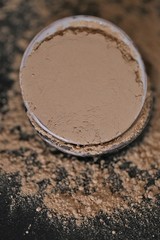 Amla  powder ayurvedic alternative medicine. Indian herbs for beauty.Amla powder in ceramic cups set on a black background. Natural herbal remedy for beautiful hair.Phyllanthus emblica.Indian 