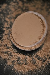 Amla  powder ayurvedic alternative medicine. Indian herbs for beauty.Amla powder in ceramic cups set on a black background. Natural herbal remedy for beautiful hair.Phyllanthus emblica