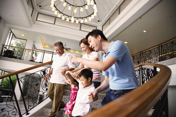 One happy family walking down to the hotel lobby