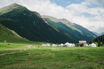 Fototapeta na wymiar Traditional yurts at Altyn Arashan where is a famous place for tourist in Kyrgyzstan