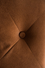 The sofa surface is made of leather.