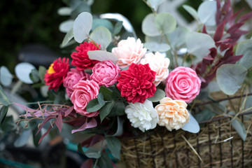 Bouquet of bright colourful colours made from soap in basket of old vintage bike