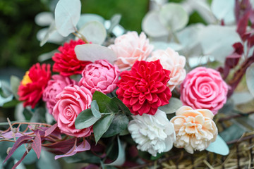 Bouquet of bright colourful colours made from soap in basket of old vintage bike