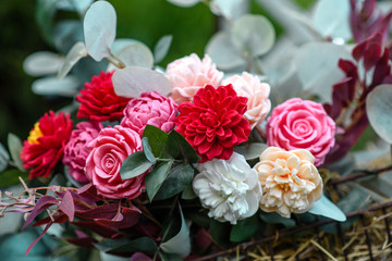 Bouquet of bright colourful colours made from soap in basket of old vintage bike