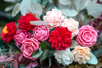 Bouquet of bright colourful colours made from soap in basket of old vintage bike