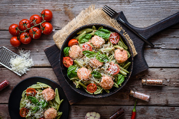 Delicious fresh pasta with meatballs, sauce, cherry tomatoes and basil