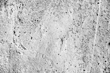 Texture of a concrete wall with cracks and scratches which can be used as a background