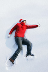 Fototapeta na wymiar Man lying in snow