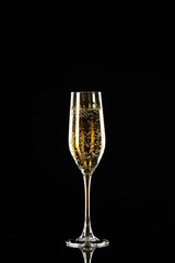 Glass of champagne on dark background
