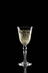 Glass of champagne on dark background