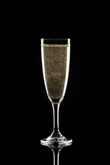 Glass of champagne on dark background