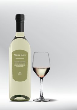glass of white wine with bottle