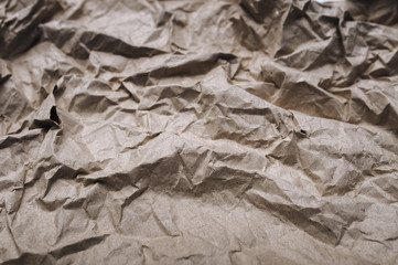 Background from crumpled light brown wrapping vintage paper.