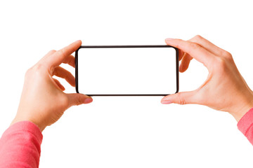Person holding in hands smartphone with blank screen and taking picture or recording video, photo isolated on white background - Powered by Adobe