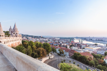 Fototapeta na wymiar Panoramic cityscape ofrom Fisherman's Bastion in summertime. Colorful sunrise in Budapest, Hungary
