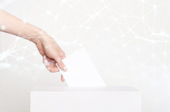 Voter Holding Ballot For Remote Voting