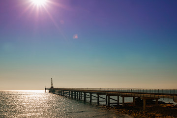 Obraz premium the pontoon on the sea at sunrise