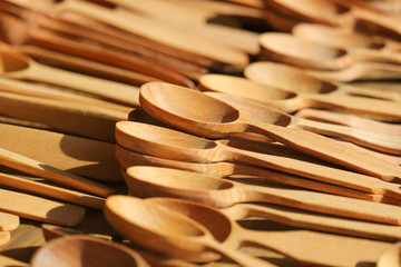 Wooden spoons in the market as a background.