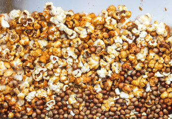 Sweet popcorn behind glass as an abstract background.
