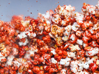 Sweet popcorn behind glass as an abstract background.