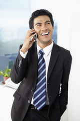 Young businessman using smart phone