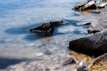 Long Exposure of Large Rocks in a Lake