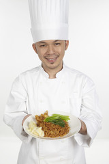 Asian chef with a plate of wonton noodles