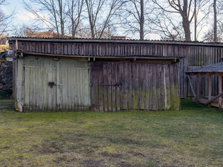 wooden sheds for storing firewood in the yard