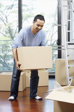 Man moving cardboard box