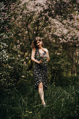 Girl in a romantic dress on the nature