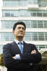 Fototapeta premium Businessman with arms crossed