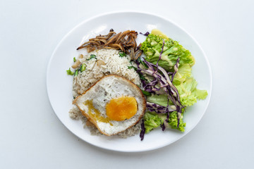 Food photography with white background, Top angle of asian food. Rice, salad, fried eggs, anchovy fried