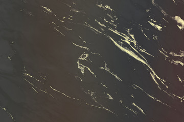 Gold pattern on a black marble background illustration