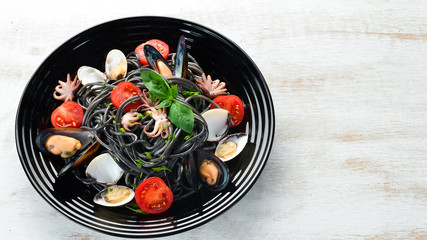 Pasta with seafood. Black paste. Seafood. Top view. Free copy space.